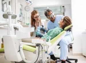 dentist giving a dental exam