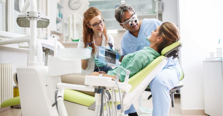 dentist giving a dental exam