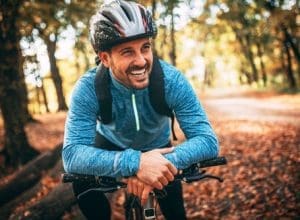 Plaque | Man on bicycle smiling