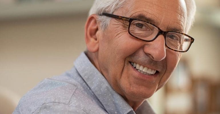 cosmetic dentistry | happy elderly man.