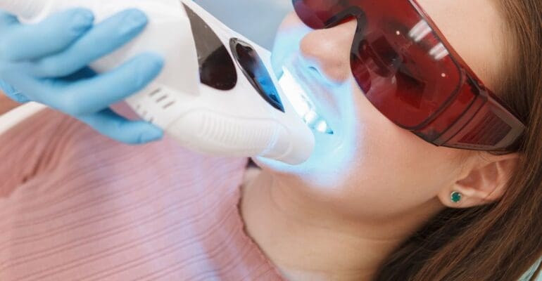 in-office teeth whitening | dentist and patient